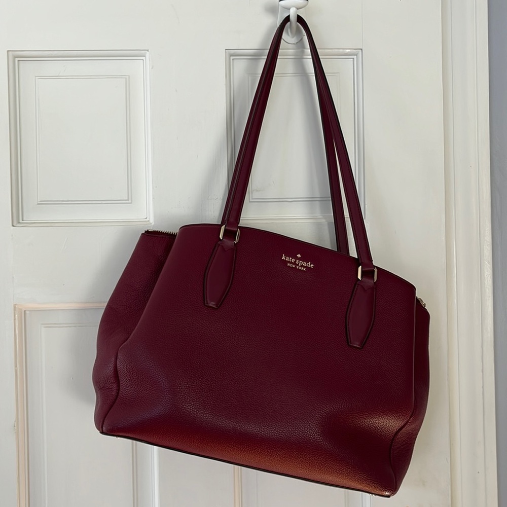 Burgundy Kate spade bag. EUC.  One small blemish on 2nd picture.